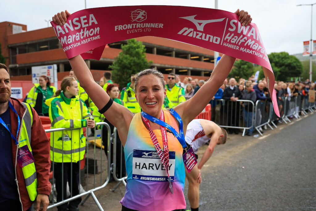 Female Winner, holding the finishing tape at the Mizuno Swansea Half Marathon 2026, Swansea, Wales, 7 June 2026.